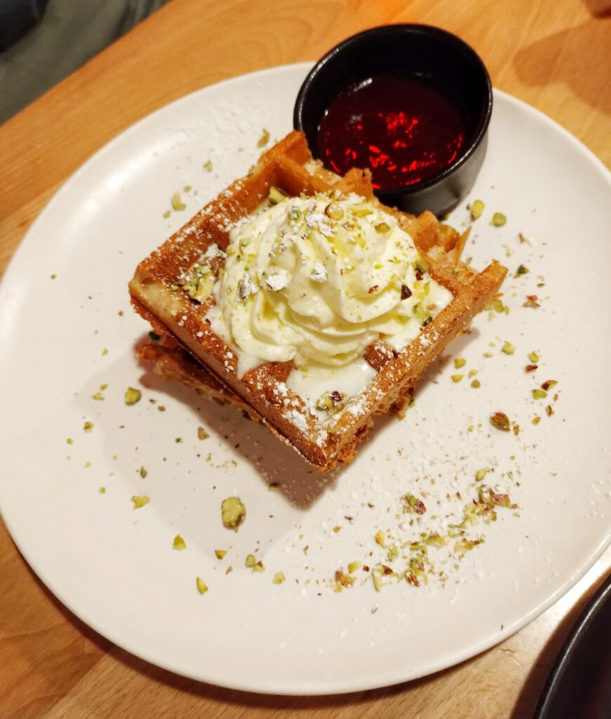 waffles and cream on a plate