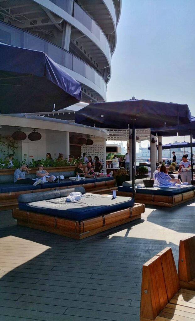 an outside bar on a cruise ship with day beds
