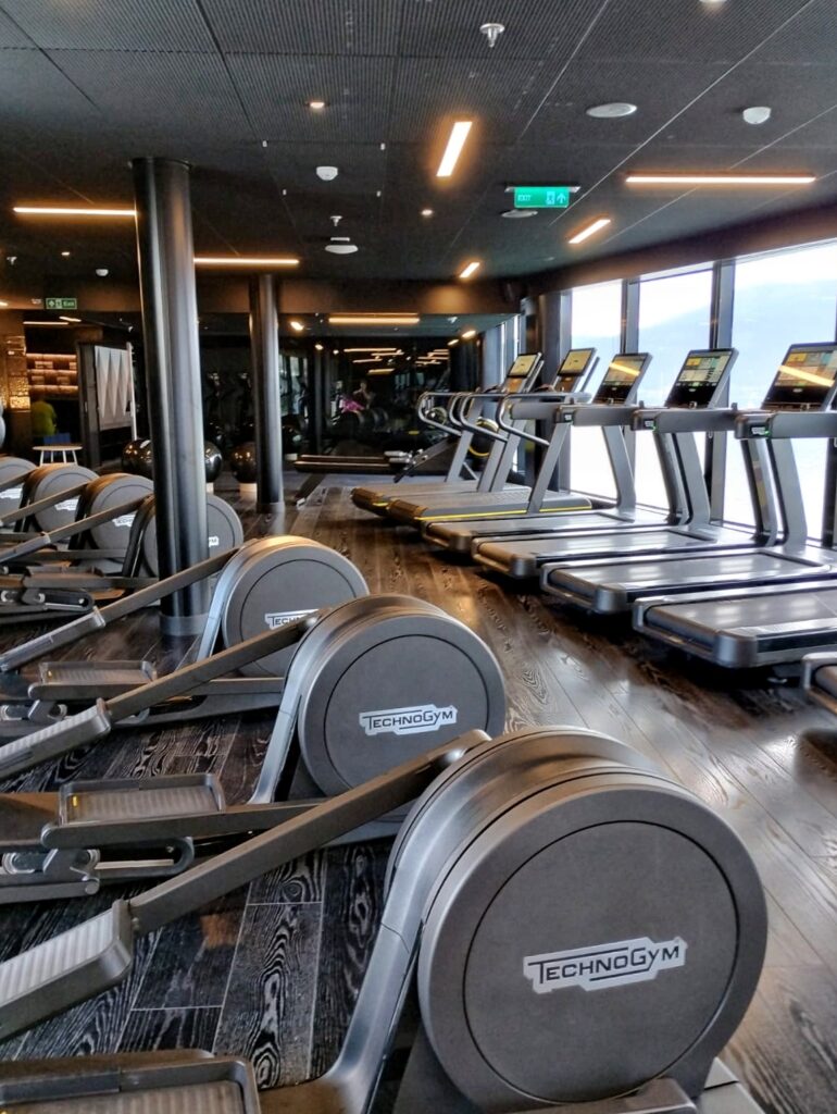 running and rowing machines inside a gym