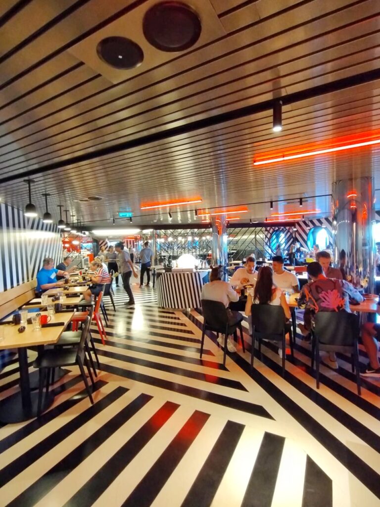 a busy restaurant with funky vibrant decor