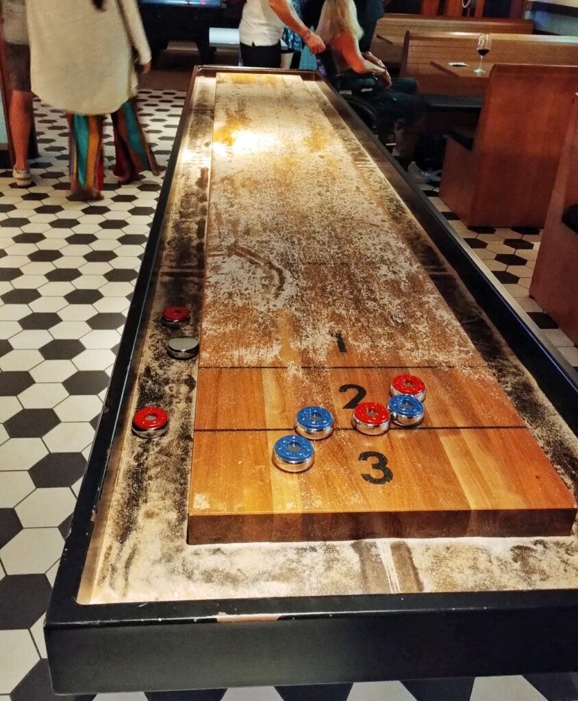 a shuffleboard table covered with sand