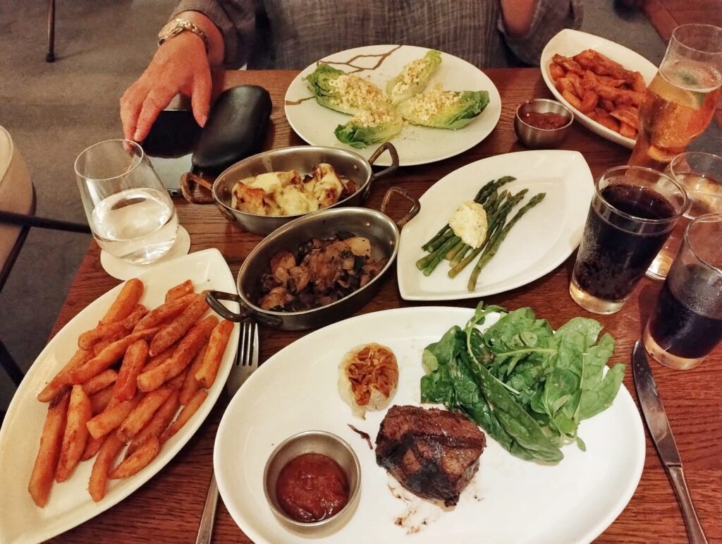 an array of food at a restaurant table