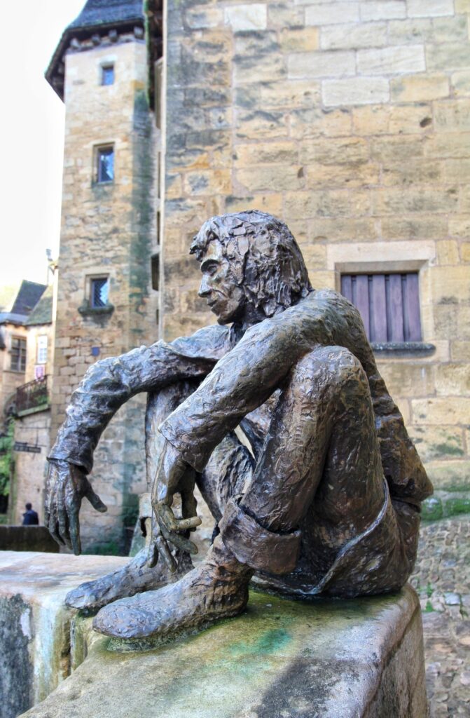 The bronze statue of Le Badaud de Sarlat in Sarlat la Caneda Dordogne