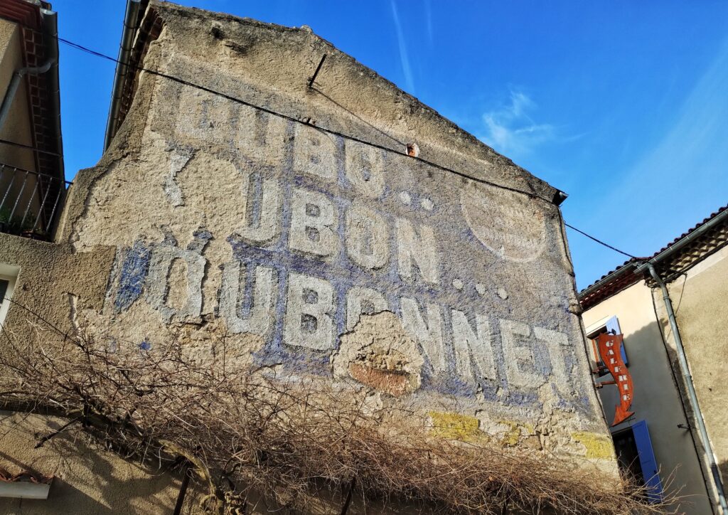 Grab Your Pillow - An old Dubonnet sign in Lautrec