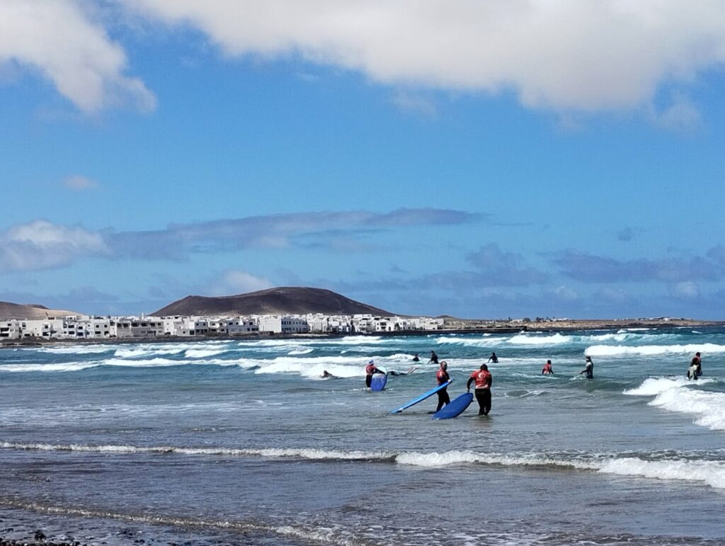 people surfing on the beach