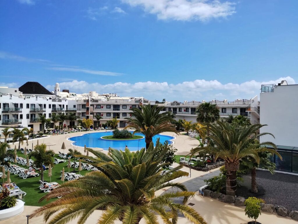 a view of a swimming pool and blue sky