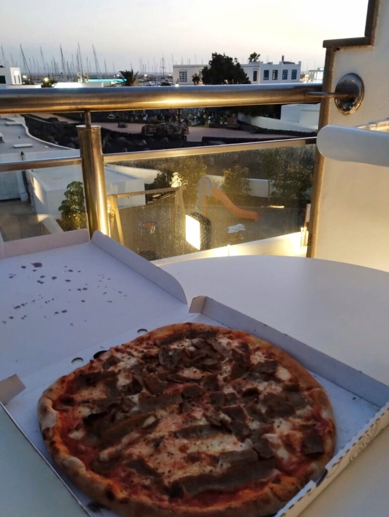 a take away meat pizza