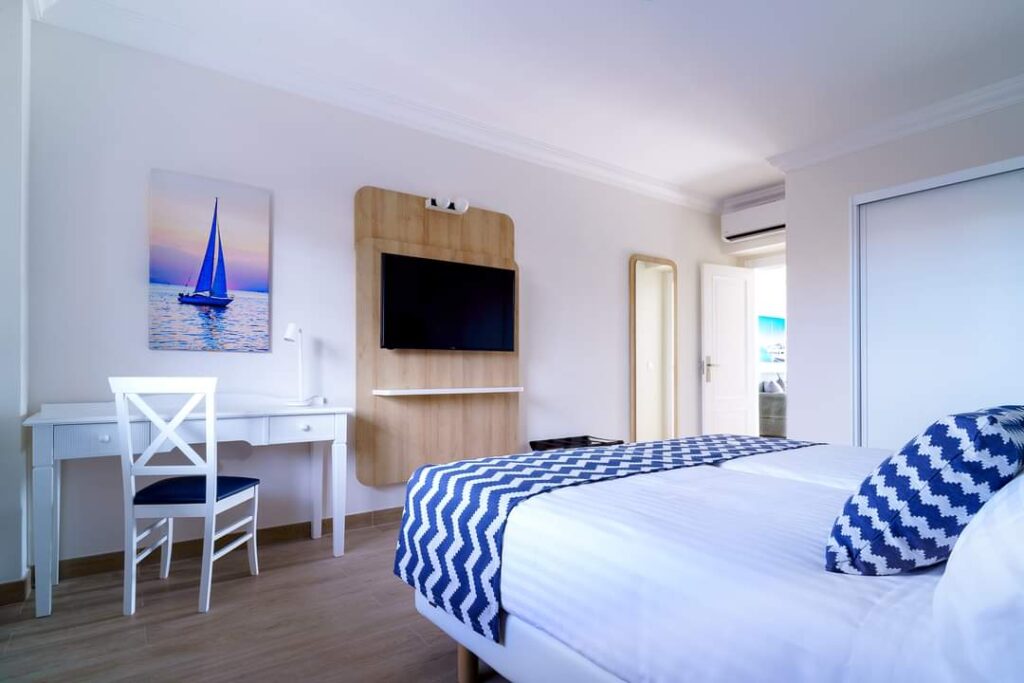 a modern bedroom with desk and chair