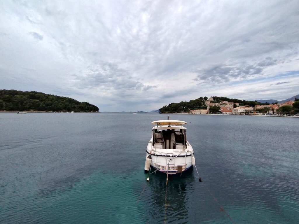 a boat looking out to sea on a cloudy day