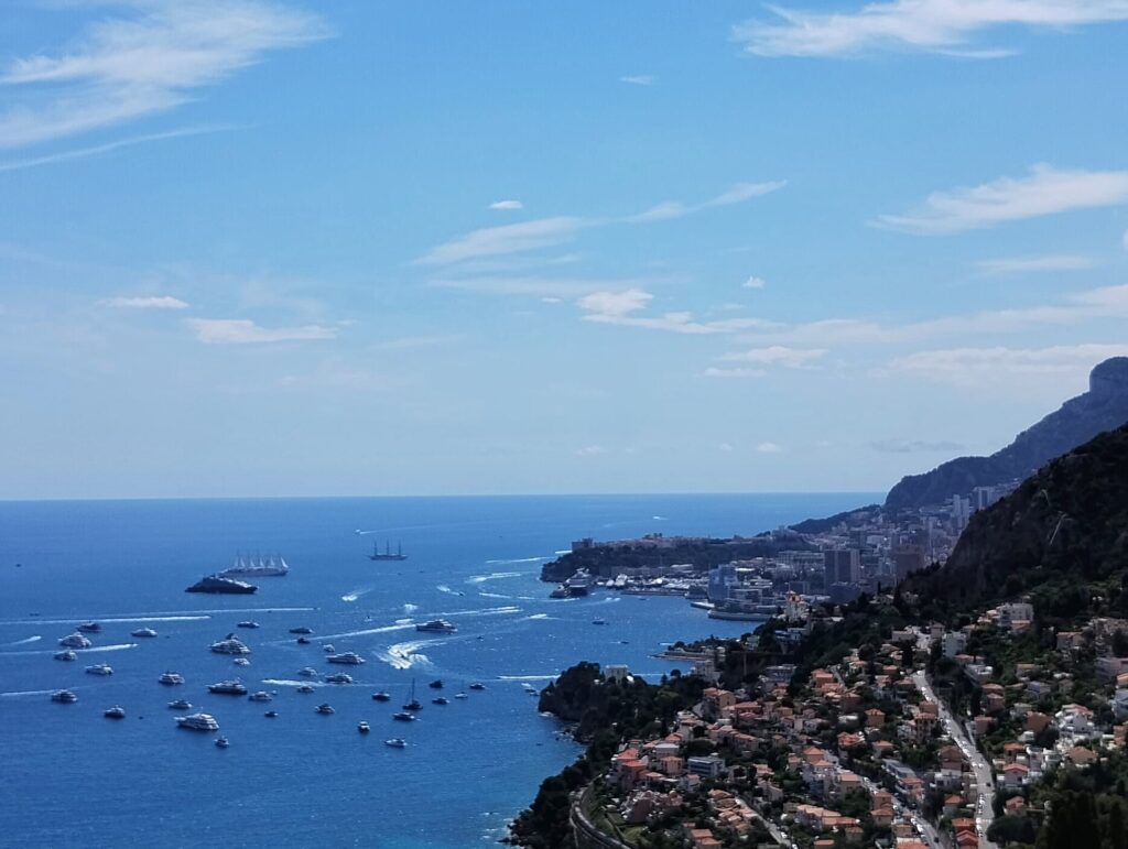 blue bay with sailing boats and cruise ships