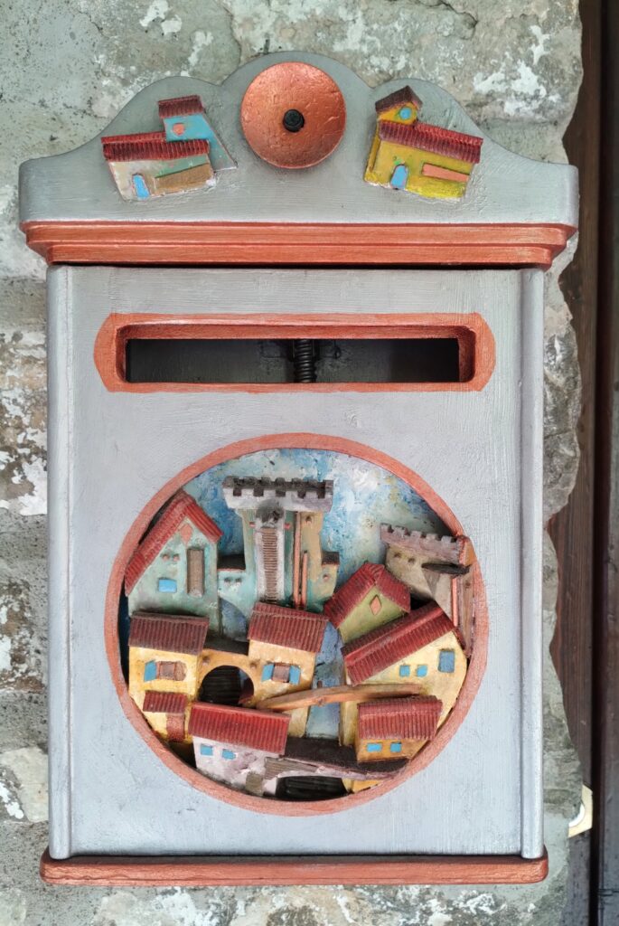 cute letterbox with wooden carving of Dolceacqua